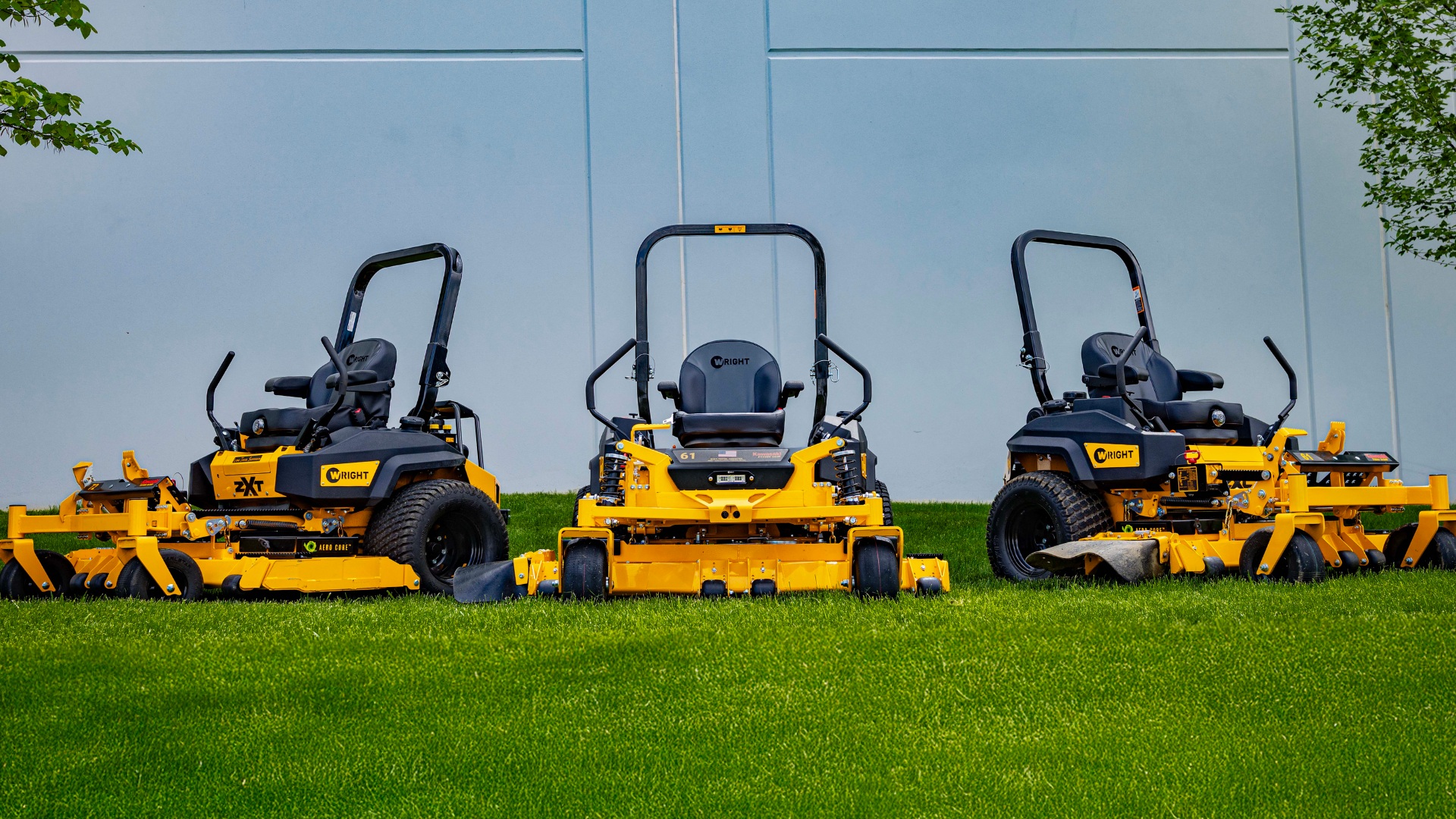 Professional commercial lawn mowers ready for weekly lawn maintenance